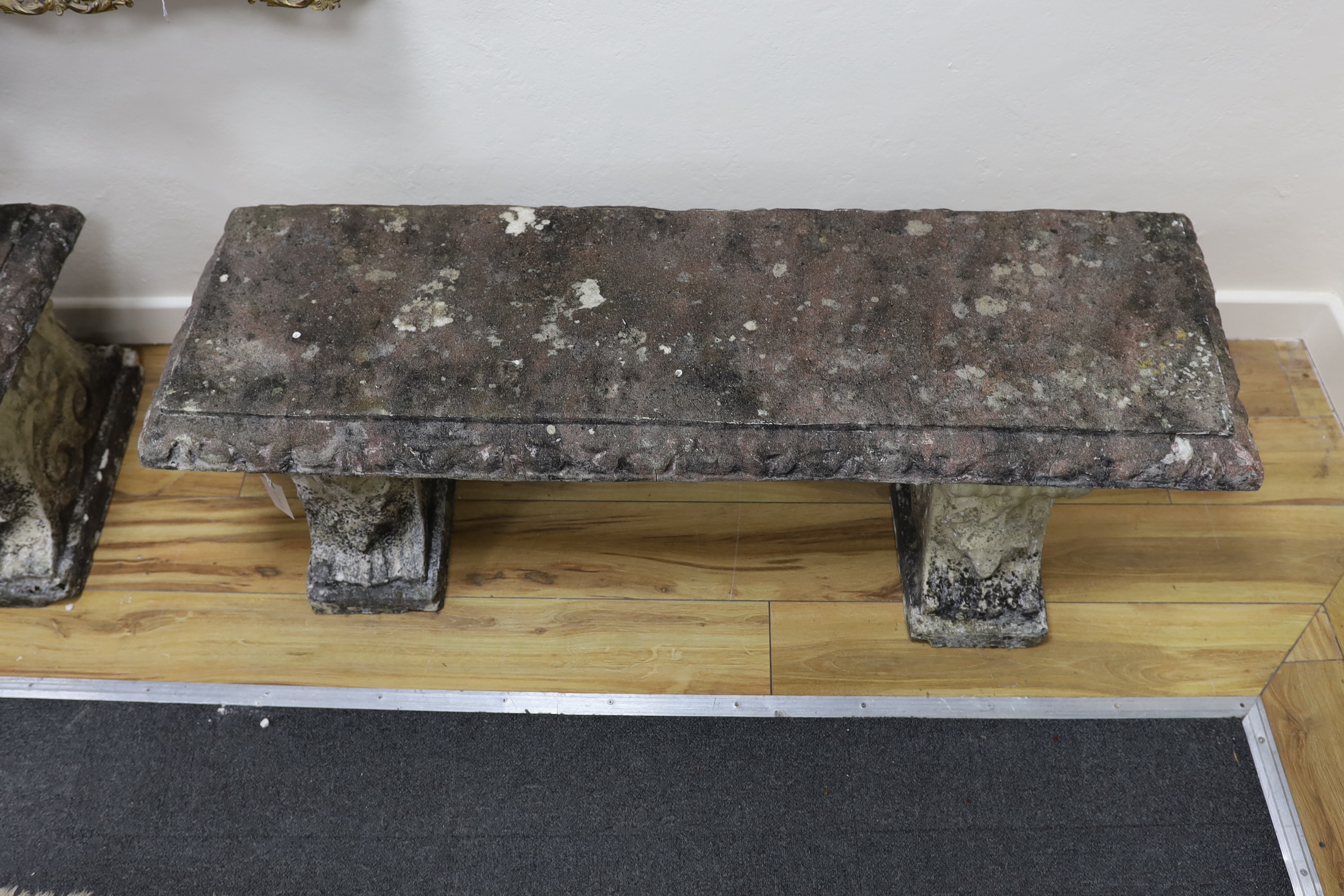 A pair of rectangular reconstituted stone garden bench seats, width 125cm, depth 40cm, height 42cm